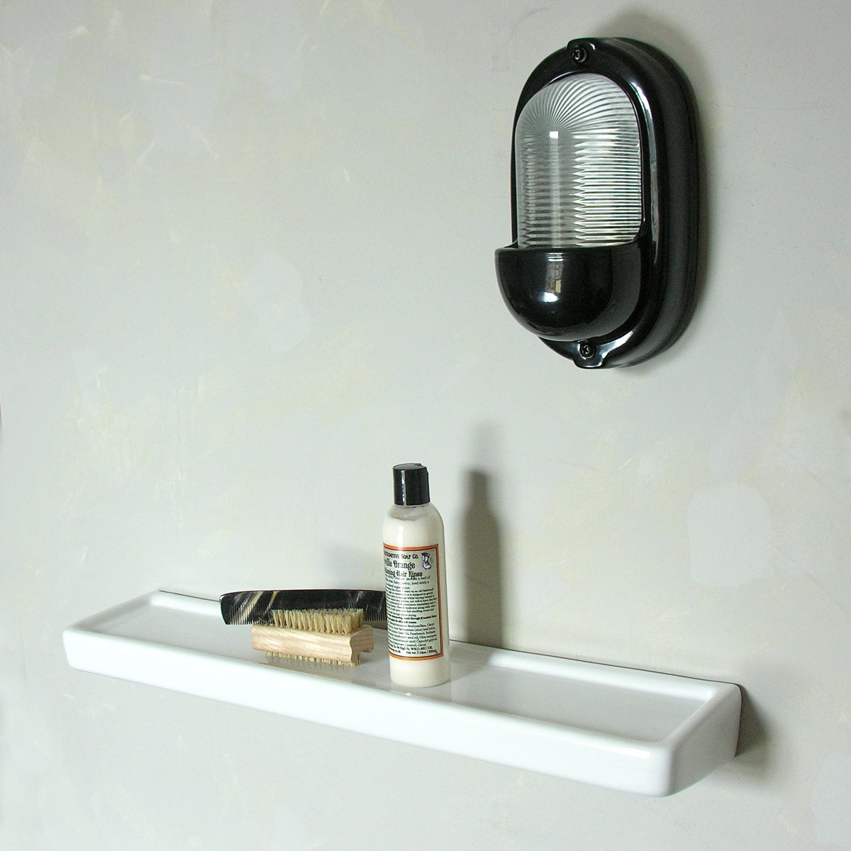 small white bathroom shelf